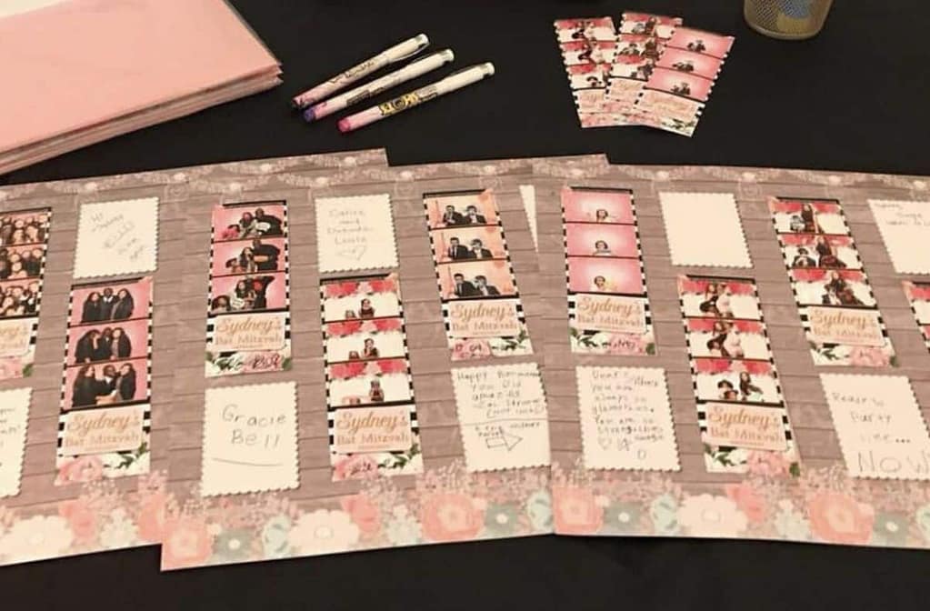 Photo booth guest book featuring personalized photo strips and handwritten messages from guests.
