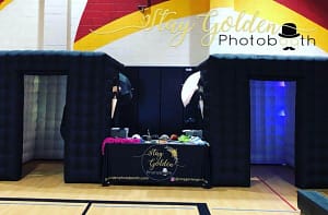 Enclosed Photo Booth setup with props and lighting by Stay Golden Photo Booth