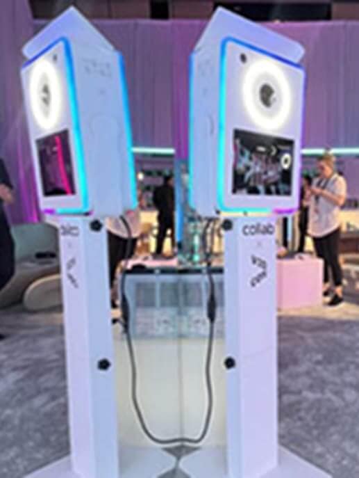Sleek digital mini photo booth with LED lighting at an event, designed for self-serve and easy drop-off.