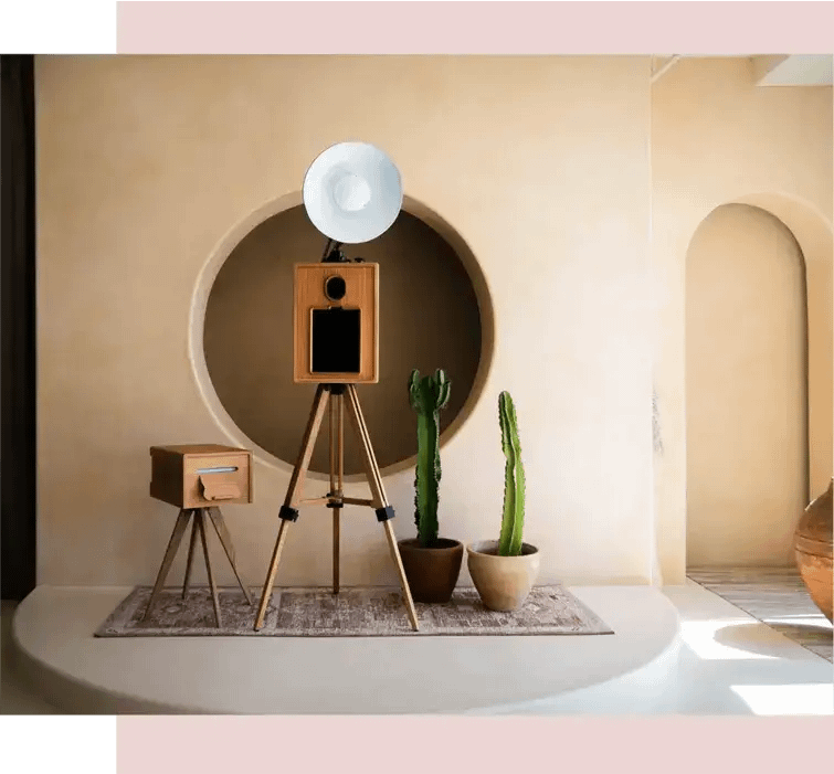 Our photo booth rental in Los Angeles with printer, modern decor, and cacti on display for events